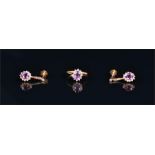 An 18ct yellow gold, amethyst and white stone cluster ring size N, together with a pair of
