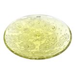 Lalique, France. A contemporary green glass bowl of circular form, decorated with flowers, in