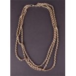 A yellow metal converted guard chain necklace with three graduated strands, and original guard chain