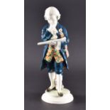 A Goldscheider model of Mozart pondering a musical score, a viola under his arm, signed 'Geugot'