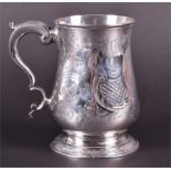 A George III silver baluster tankard London 1779, by Jasper Kelly, the body engraved with flowers