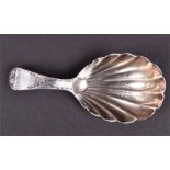 A Georgian silver caddy spoon with bowl in the form of a shell and bright-cut and engraved