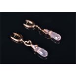 An 18ct rose gold and rose quartz drop earrings each set with a tapered rose quartz drop, within