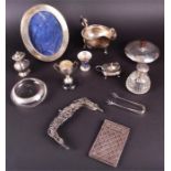 A mixed collection of silver items to include a George V sauce ladle, London 1933 (maker's mark