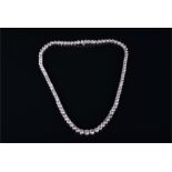 An impressive white gold and diamond necklace set with eighty-eight round brilliant cut graduated