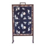 A late 19th / early 20th century Chinese silk room screen the dark blue silk, gilt bordered with