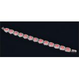 A sterling silver, marcasite and coral bracelet 925 standard, composed of thirteen shaped links each