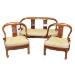 A Chinese polished hardwood three-piece suite to include a pair of horseshoe shaped chairs and