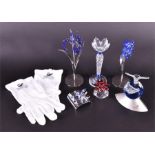 A quantity of Swarovski items to include a single candlestick, a Millenium figurine of a bird