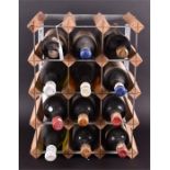 A rack of bottles of red and white wine to include Riserva Ducale Chianti and Rosso Vecchio