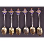 An associated set of six George V silver teaspoons with gilt bowls and enamelled handles detailing