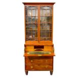 A 19th century mahogany secretaire bookcase with later added lighting the top with two astral and