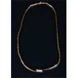 A yellow metal and diamond necklace the articulated link necklace set with two long white and yellow