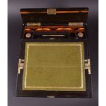 A late 19th / early 20th century coromandel writing slope the hinged flap opening to reveal green