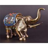 A 20th century Chinese silver gilt model of an elephant  stamped 925, presented with an enamelled