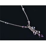 An 18ct white gold blue topaz, amethyst, and prasiolite drop pendant necklace suspended with