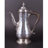 A George III silver coffee pot London 1764, makers mark indistinct, of plain baluster form supported