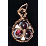 A yellow metal, garnet, and enamel pendant set with three round cabochon garnets within an enamelled