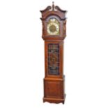 A 20th century longcase clock the silvered dial with black Roman numerals and Tempus Fugit