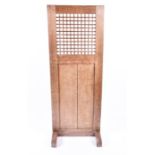 A pale oak Arts & Crafts dressing screen with lattice work panel. 149.5 cm high.