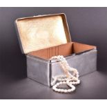 An Edwardian silver cigar box Birmingham 1904, by A & J Zimmerman Ltd, of rectangular form with worn