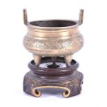 A small Chinese bronze censer together with two further brass examples the bronze example