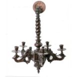 An early 20th century carved beech chandelier with spiral twist column and five carved scrolling