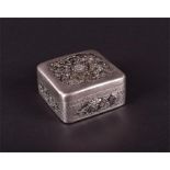 An early 20th century Chinese silver pill box 700 standard, of square form, the hinged cover