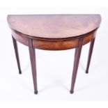 A 19th century mahogany demi-lune card table the crossbanded top opening to reveal a baize lined