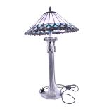 A decorative contemporary desk lamp in the Tiffany style the silvered metal-work base in the form of