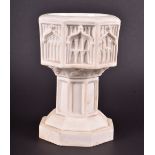 A Parianware miniature font of octagonal form, with moulded panel decoration on panelled column