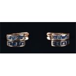 A pair of yellow metal and sapphire earrings each channel-set with four square-cut sapphires, 13