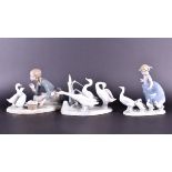 A Lladro group of a girl feeding two ducks together with another of a little girl with ducklings,