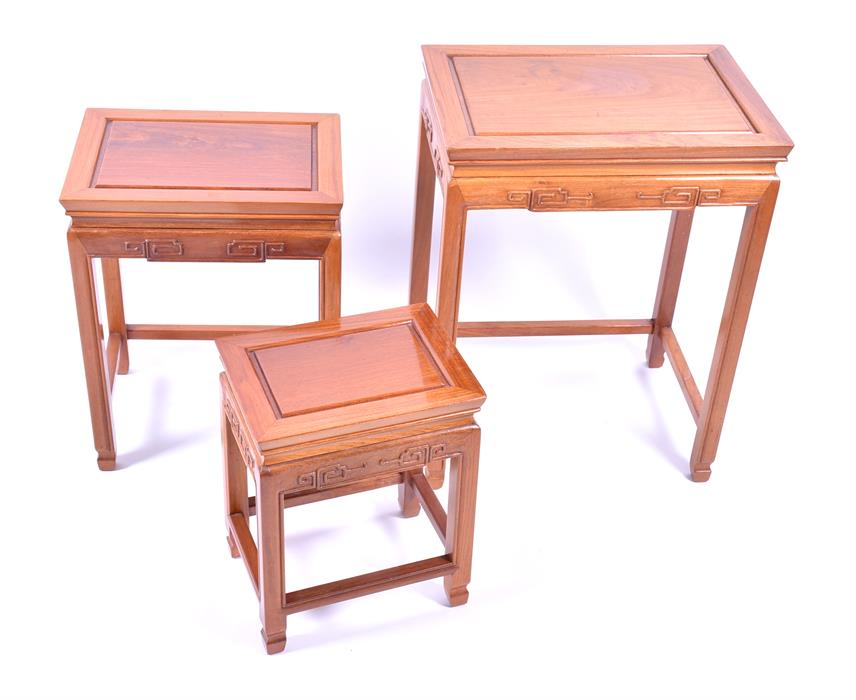 A graduating nest of three Chinese hardwood occasional tables each with incised scrolling angular - Image 2 of 4