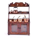 A 19th century miniature dresser containing miniature copper and brass kitchenalia and an iron,