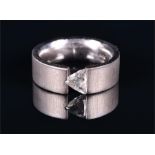 An 18ct white gold and diamond ring set with a trillion cut diamond of approximately 0.78 carats,