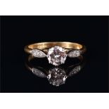 An 18ct yellow gold and solitaire diamond ring set with a round brilliant cut diamond of