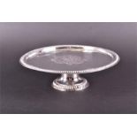 A William III / Queen Anne transitional silver tazza London 1702, of round form with gadrooned