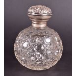 An Edwardian cut-glass silver-topped scent bottle Birmingham 1907, by Henry Matthews, of globe form,