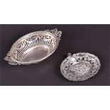 A Continental silver pieced and reticulated oval dish with ribbon-shaped handles, 15 cm long,