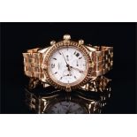 An 18ct yellow gold Breitling automatic chronograph wristwatch the white dial with gilt baton hour