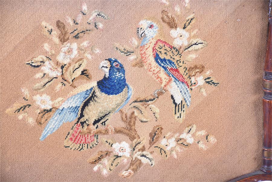 A William IV Regency pole screen the needlework panel embroidered with a scene of parrots, with - Image 3 of 8