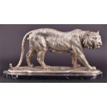 A Chinese reproduction model of a prowling tigress in plated bronze, on a marble base, 23 cm high,