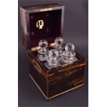 A 19th century brass bound coromandel decanter box the purple felt-lined interior accommodating four