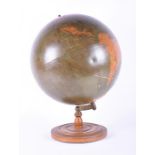 An early 20th century 19" Philips Terrestrial globe 1:26,000,000 scale, supported on a turned wooden