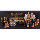 A small set of brass postal scales and weights together with a chess set (with unmatched knights and