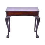 A small Georgian mahogany side table  the rectangular top supported on shell carved swept claw and