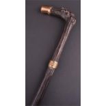 A Victorian gold capped walking cane  in polished crooked palm wood, the applied cap engraved L.H