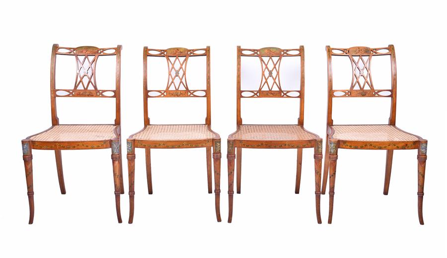 A set of four 19th century Sheraton Revival satinwood chairs each with cane seats and finely painted