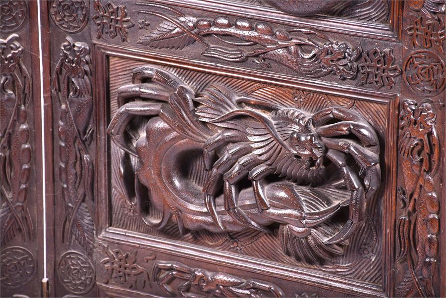A large and impressive early 20th century Oriental hardwood screen the three panels elaborately - Image 10 of 17